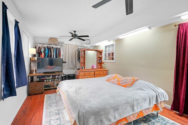 bedroom featuring ceiling fan and wood-type flooring