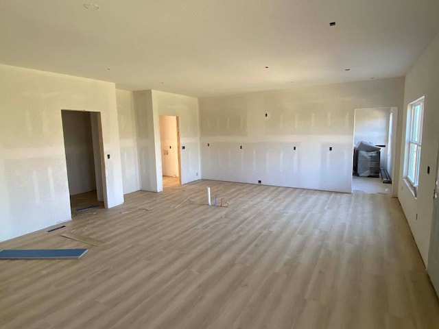 unfurnished room with light hardwood / wood-style floors