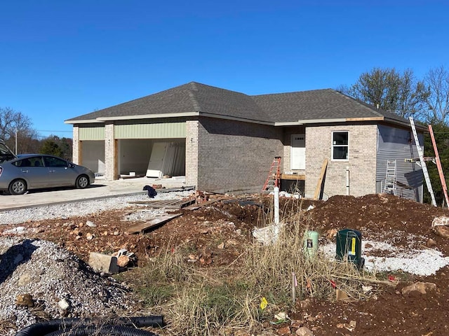 view of side of property featuring a garage