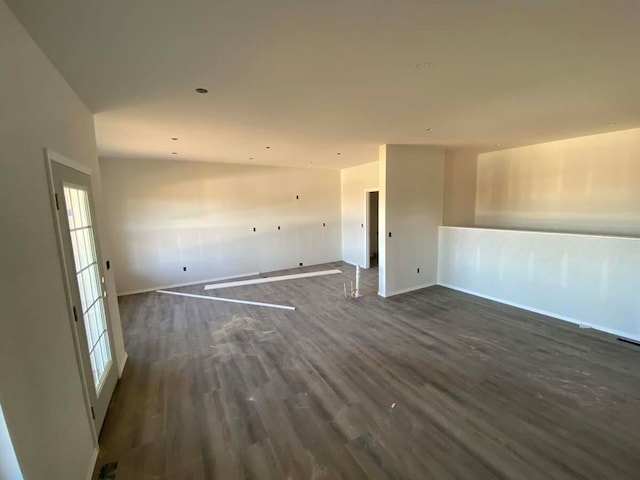 spare room with dark hardwood / wood-style floors