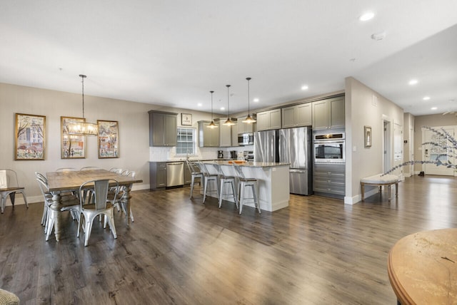 270 Chateau Cove Dr, Branson, MO 65616 - kitchen featuring recessed lighting, a kitchen breakfast bar, stainless steel appliances, gray cabinets, and a kitchen island