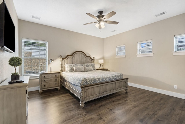 bedroom with ceiling fan and dark hardwood / wood-style flooring