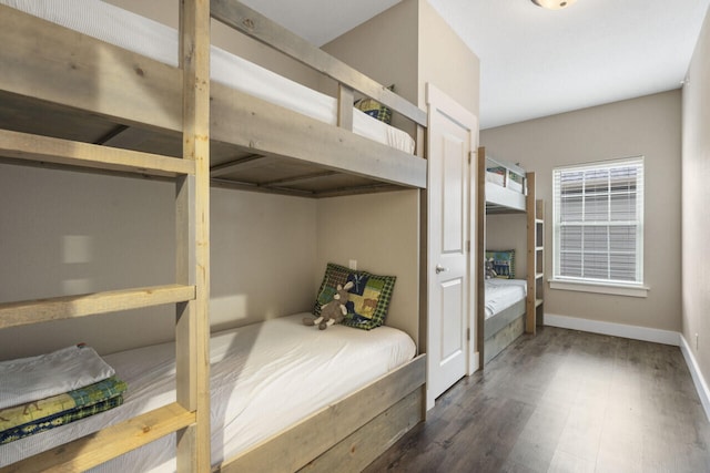 bedroom featuring dark hardwood / wood-style flooring