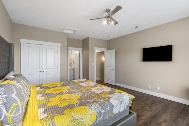 bedroom featuring ensuite bathroom, ceiling fan, dark wood-type flooring, and a closet