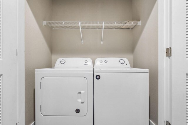 washroom with separate washer and dryer