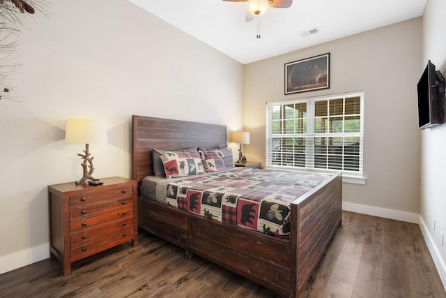 bedroom featuring dark hardwood / wood-style floors and ceiling fan