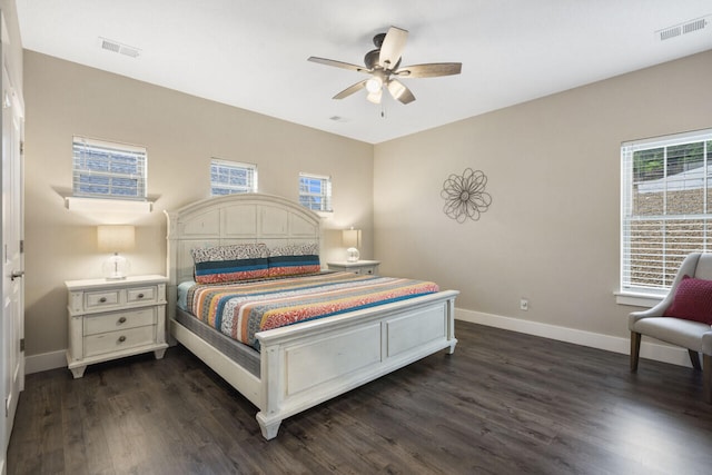 bedroom with dark wood-type flooring and ceiling fan