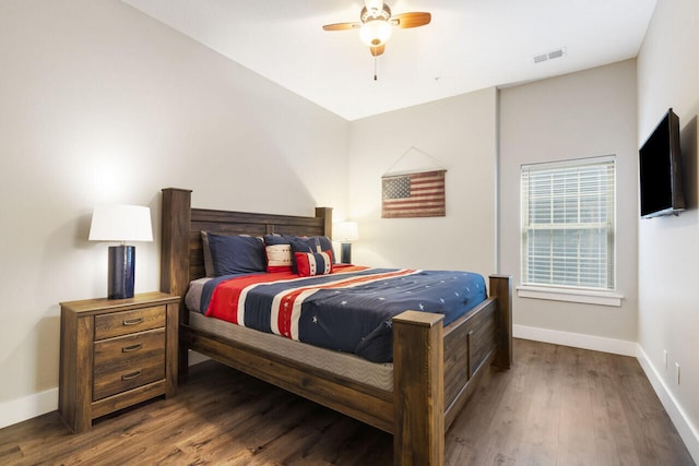 bedroom featuring ceiling fan, vaulted ceiling, and dark wood-type flooring