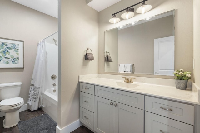 full bathroom with shower / bath combo with shower curtain, hardwood / wood-style floors, vanity, and toilet