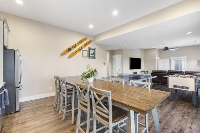 dining area featuring ceiling fan and hardwood / wood-style floors