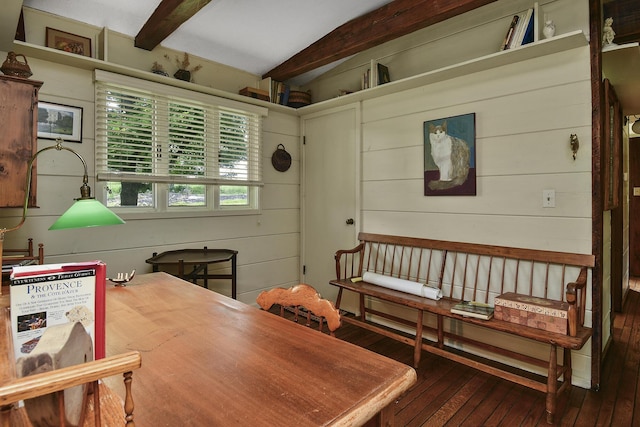 interior space with hardwood / wood-style flooring, wood walls, and vaulted ceiling with beams