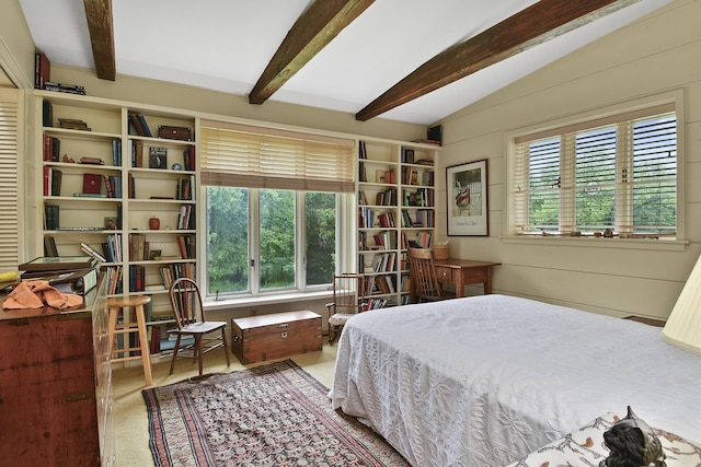bedroom featuring lofted ceiling with beams