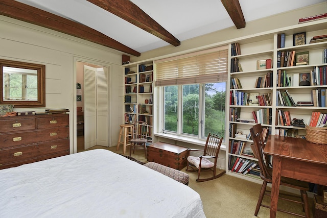 bedroom with carpet and beam ceiling