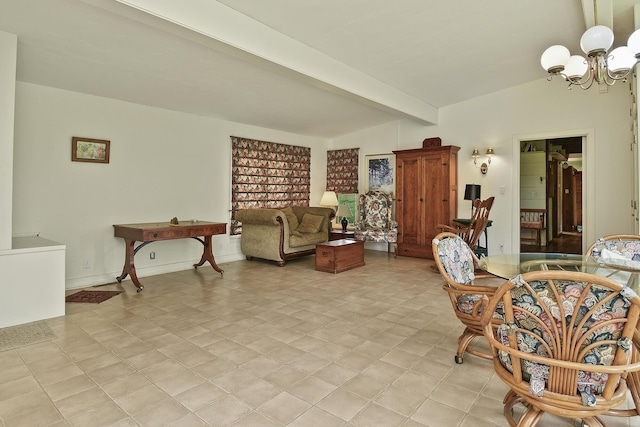 living area featuring a chandelier