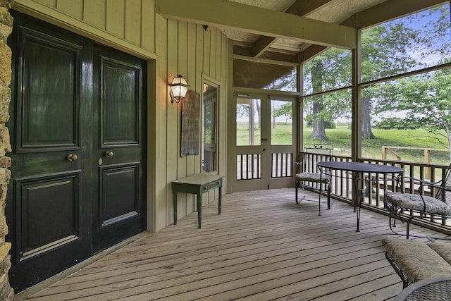 sunroom / solarium with french doors and beam ceiling