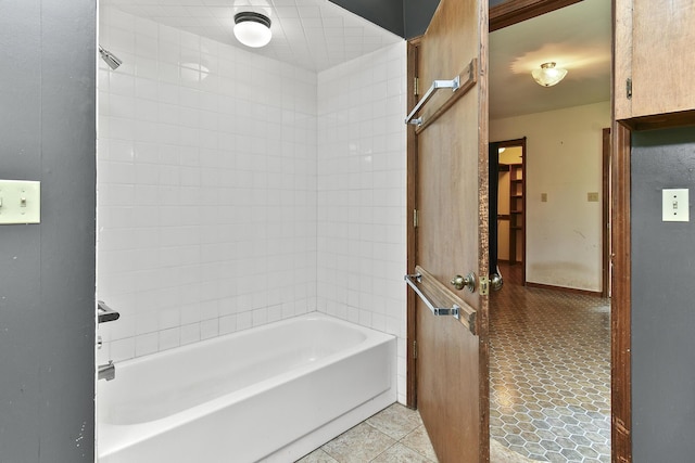 bathroom featuring shower / bathing tub combination and tile patterned floors