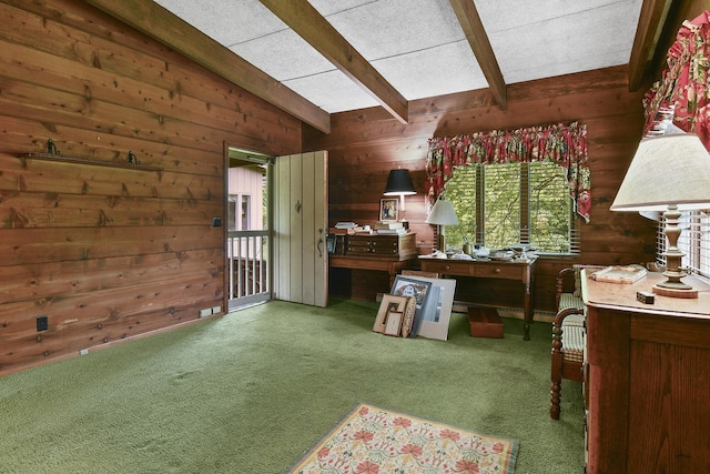 kitchen with lofted ceiling with beams, wood walls, and carpet