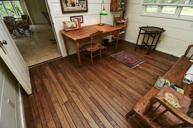 dining area featuring wood-type flooring and a wealth of natural light