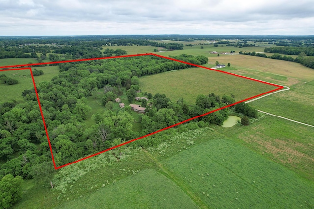 birds eye view of property featuring a rural view