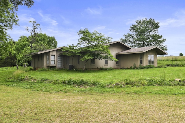 view of property exterior featuring a yard