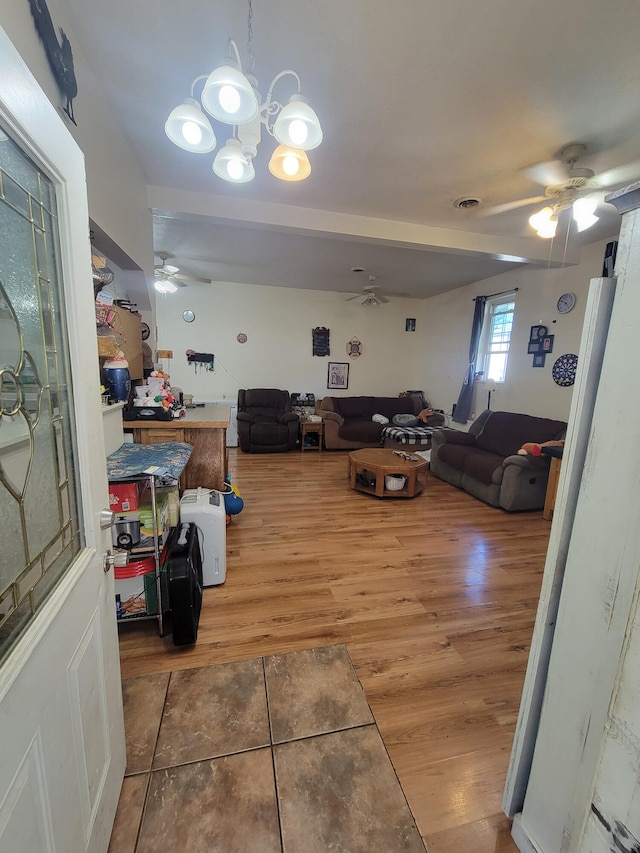 5317 E Ave, Morrisville, MO 65710 - interior space with ceiling fan with notable chandelier, wood finished floors, and visible vents