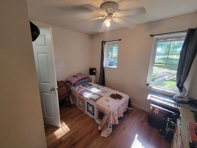 bedroom featuring hardwood / wood-style flooring and ceiling fan