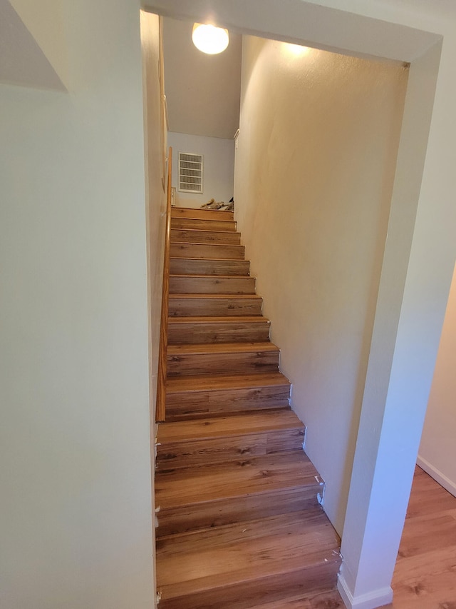 5317 E Ave, Morrisville, MO 65710 - staircase with wood finished floors and visible vents
