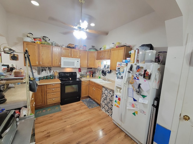 kitchen with white appliances, light wood-type flooring, and ceiling fan