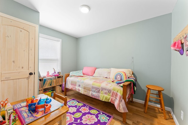 bedroom featuring wood-type flooring