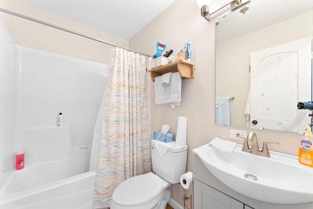 full bathroom with shower / tub combo with curtain, vanity, and toilet