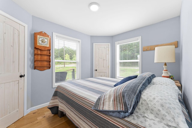 bedroom with light hardwood / wood-style floors