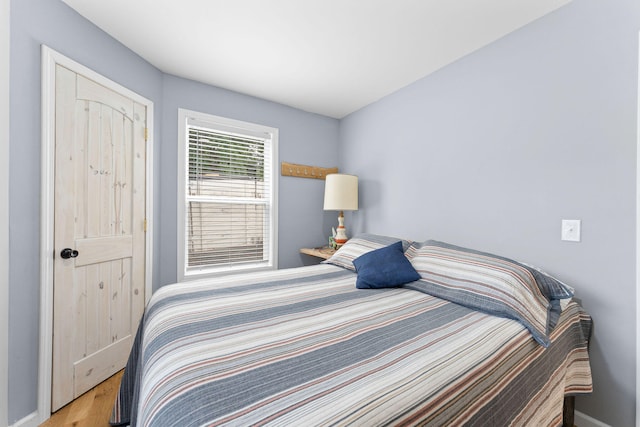 bedroom with light hardwood / wood-style floors