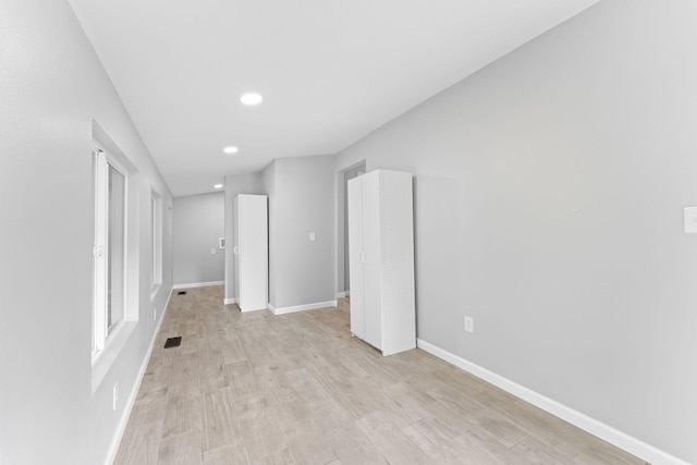 spare room featuring light wood-type flooring