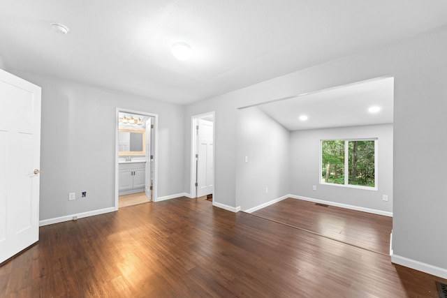 unfurnished room with dark hardwood / wood-style floors