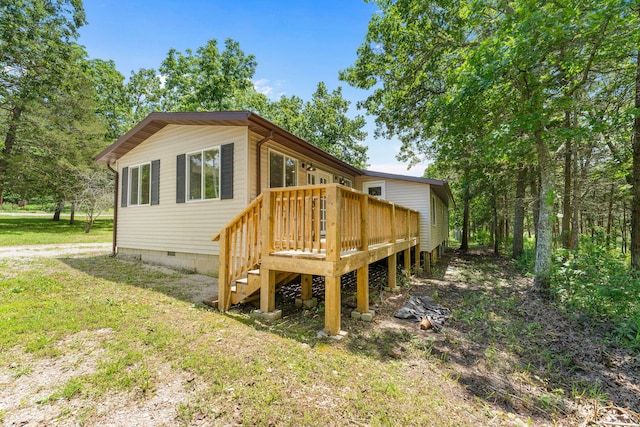 exterior space with a deck and a yard