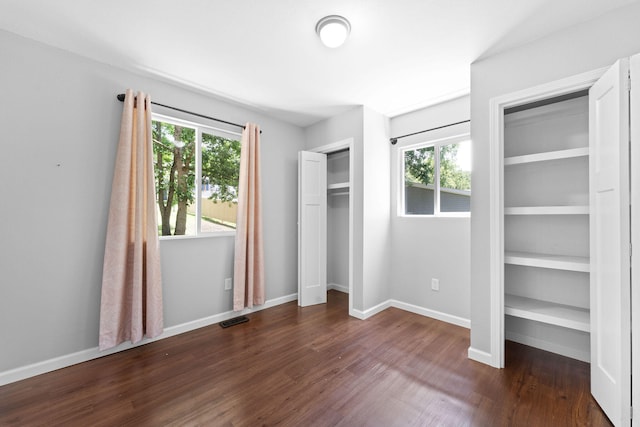 unfurnished bedroom featuring dark hardwood / wood-style floors