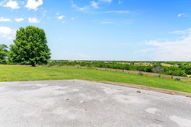 view of yard with a rural view