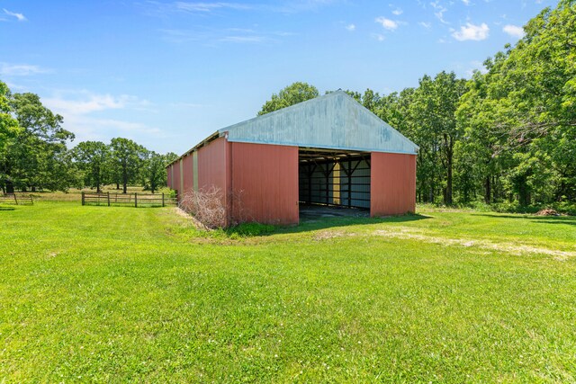 view of outdoor structure featuring a lawn