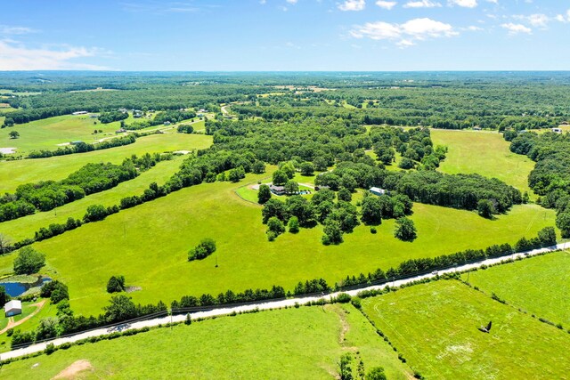 birds eye view of property featuring a rural view