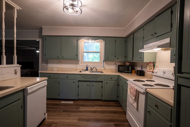 kitchen featuring a textured ceiling, sink, dark hardwood / wood-style flooring, and white appliances