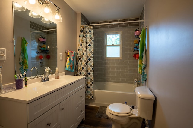 full bathroom featuring vanity, hardwood / wood-style floors, toilet, and shower / tub combo with curtain