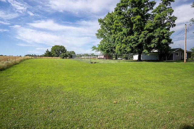 view of yard with a rural view