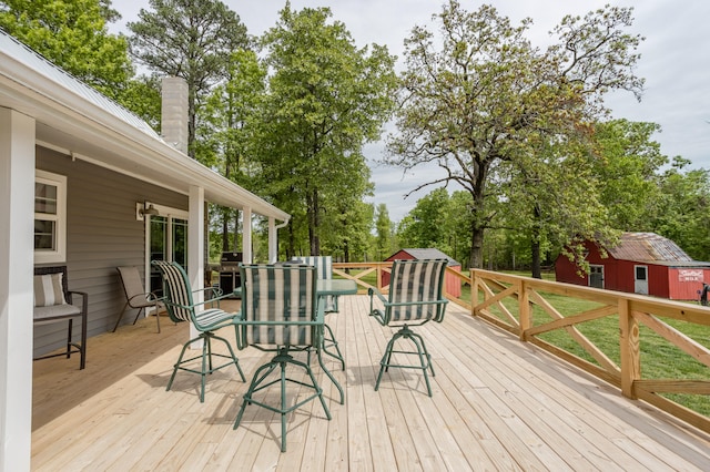 wooden deck featuring area for grilling