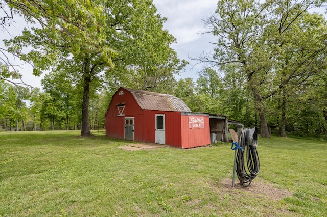 view of outbuilding with a lawn