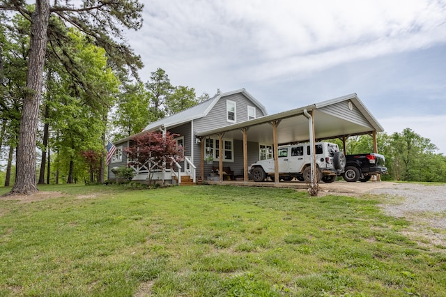 rear view of property with a lawn and covered porch