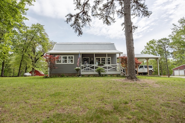 exterior space with an outdoor structure and a lawn