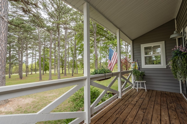 unfurnished sunroom with lofted ceiling