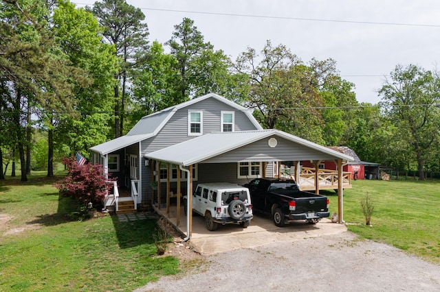 view of front facade featuring a front lawn and a carport