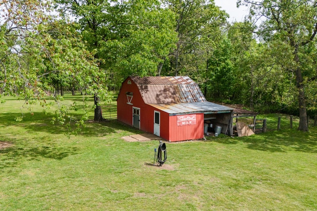 view of outbuilding with a yard