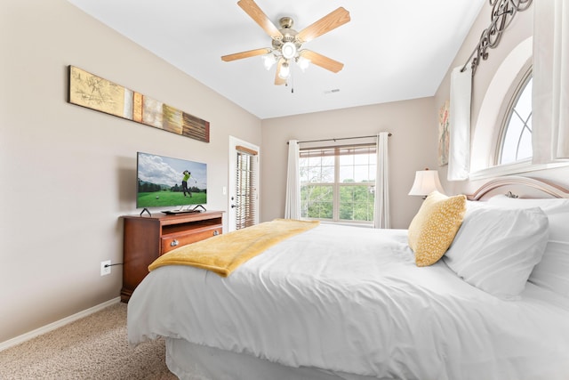 bedroom featuring carpet, visible vents, a ceiling fan, and baseboards